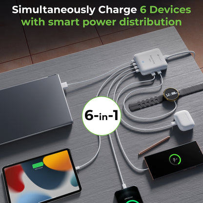 6-in-1 charging station with multiple devices on a wooden surface